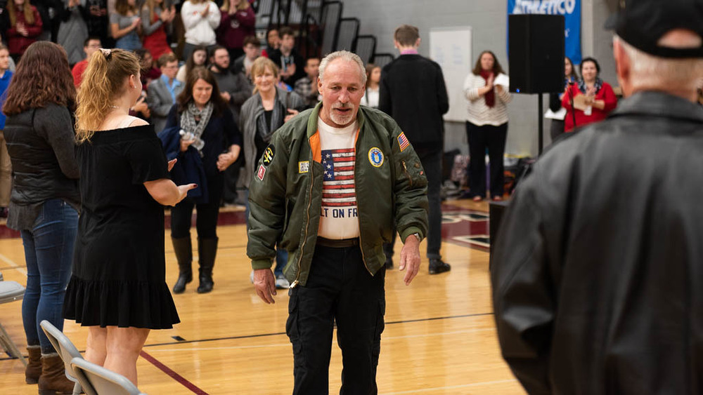 Veteran in school gym at assembly