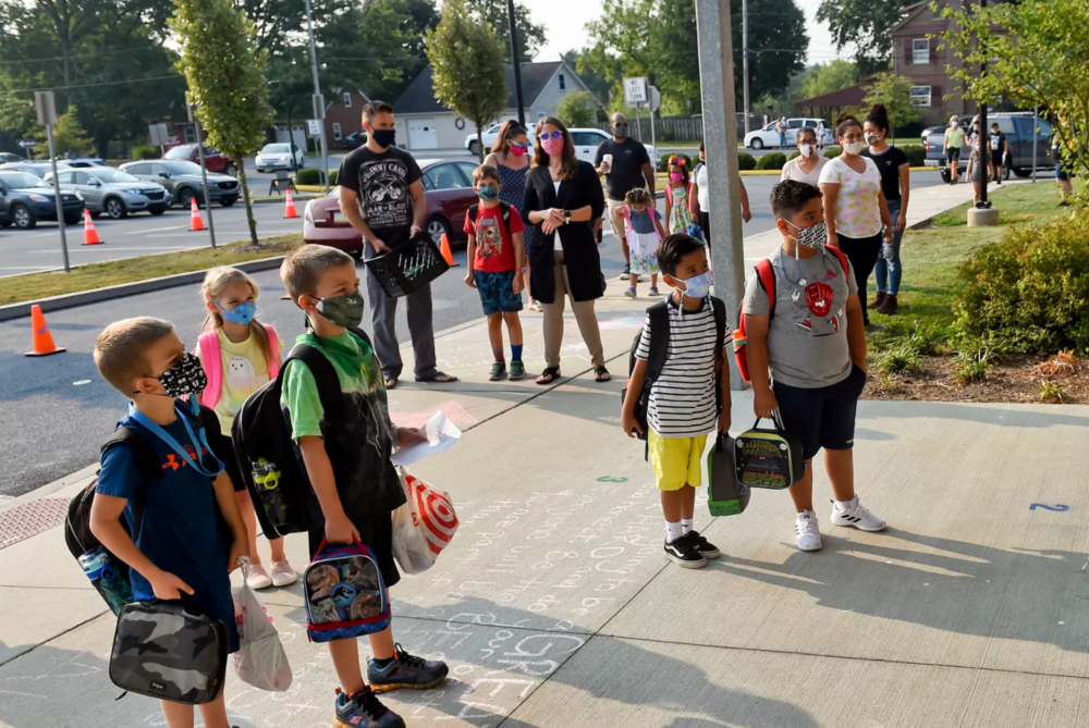 Students enter Perry Elementary School in Shoemakersville, Pennsylvania on the first day of school in August. Photo by Ben Hasty/MediaNews Group/Reading Eagle via Getty Images